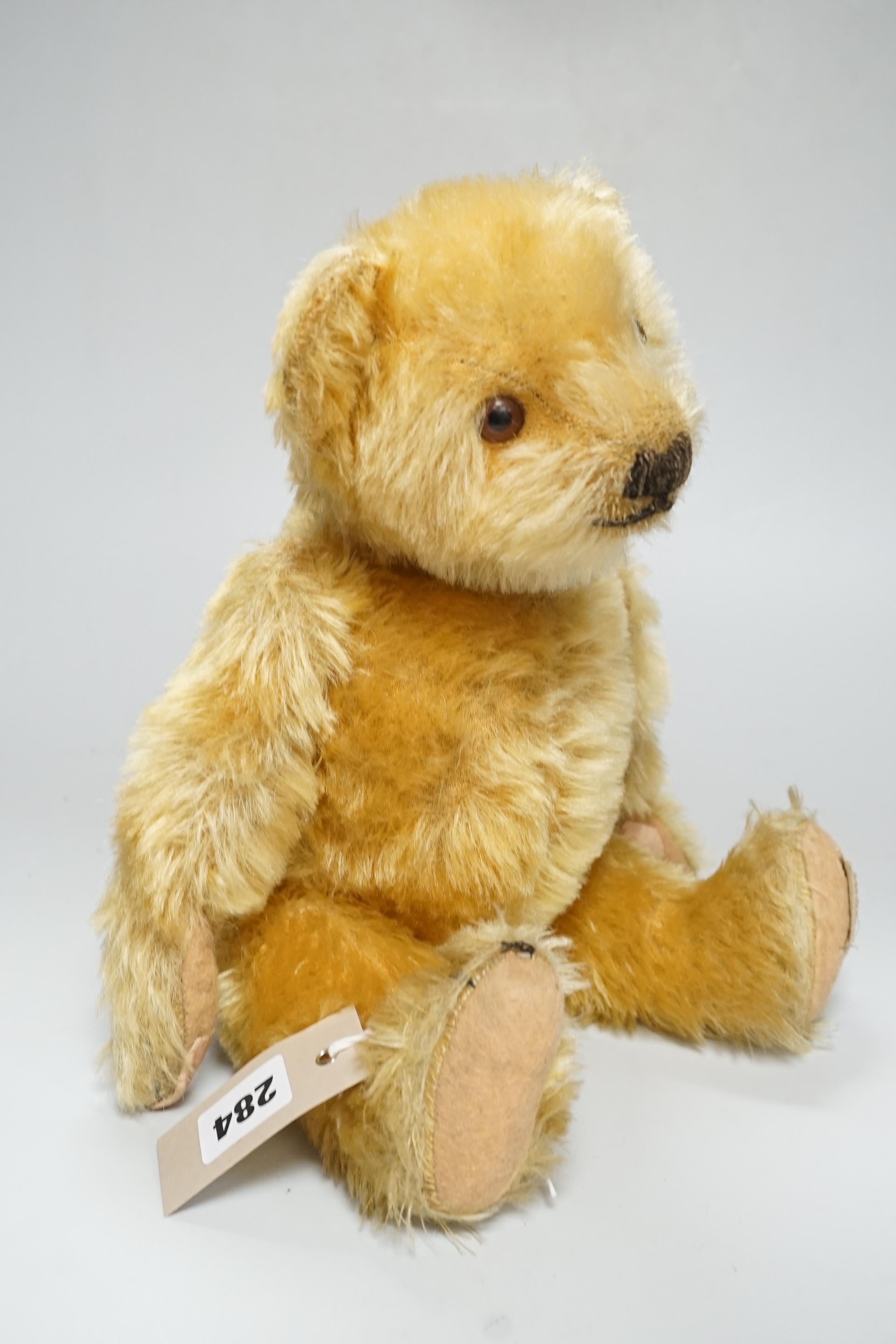 A Deans 1950's mouse eared bear, label on left foot, 16in., repair to paw pads, good mohair